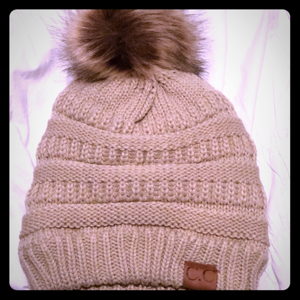 Beige C.C wool lined beanie with fur Pom Pom, new.